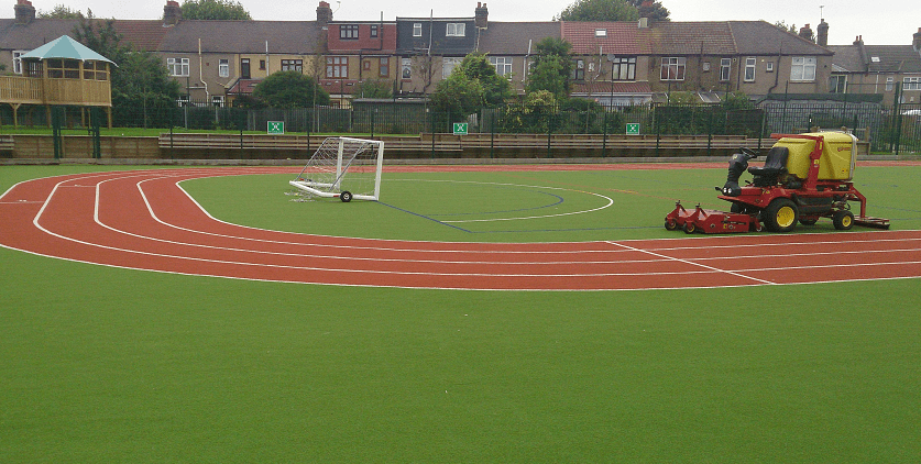 artificial turf maintenance on athletics grass