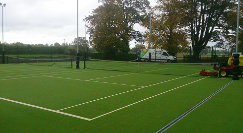 maintenance machine on astro turf tennis courts