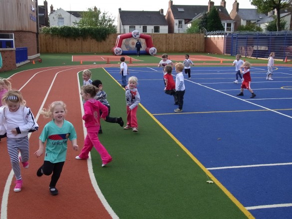 young children on artificial turf playground
